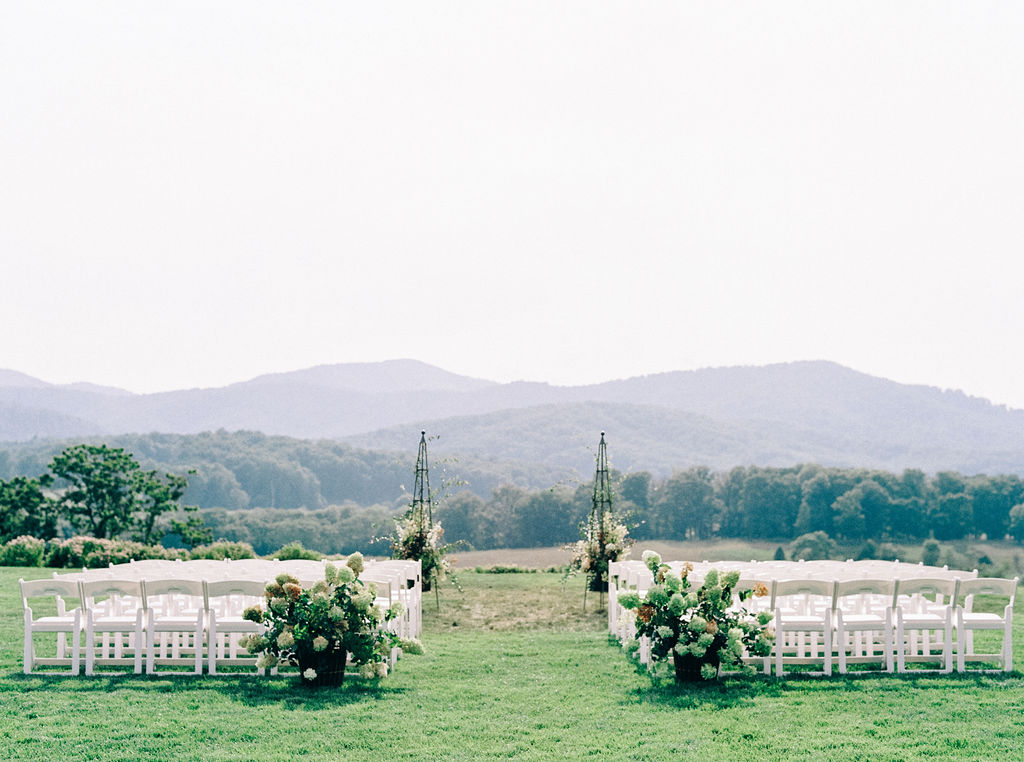 A dreamy and romantic Pippin Hill Wedding in Charlottesville, Virginia. The hydrangeas were in full bloom for the most romantic summer wedding. The views of the Blue Ridge Mountains at their ceremony site are spectacular.  