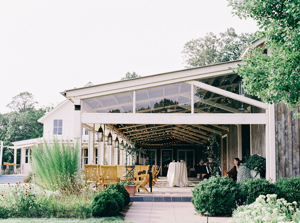 A dreamy and romantic Pippin Hill Wedding in Charlottesville, Virginia. The hydrangeas were in full bloom for the most romantic summer wedding. Shown are details inside the reception space at Pippin Hill. 